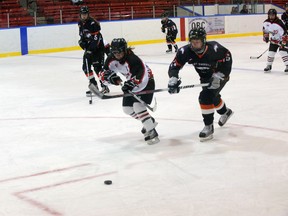 MONTE SONNENBERG Simcoe Reformer
Kassie Courrier of the Norfolk HERicanes bantam B squad wins this race for the puck against a Kent County defender during a double-header Saturday at Talbot Gardens. The local girls won Game 1 by a score of 1-0 but dropped the second match 2-0.