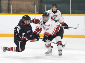 MONTE SONNENBERG Simcoe Reformer
Nick Hirst, right, of the Ayr Centennials delivered this punishing hit on Clayton Chiarot of the Norfolk Rebels during Sunday’s game in Port Dover. The conference champs from Ayr up-ended Port Dover by a score of 9-1.