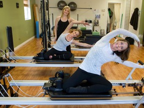 Front to rear ?  Collette Brown, Renee D?Orsay and Megan Orser are instructors at Create Balance Pilates in Lambeth. (DEREK RUTTAN, The London Free Press)