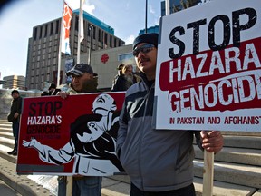 Demonstrators gather during a protest at Churchill Square expressing anguish and sorrow at the ongoing genocide of Pakistani Hazara citizens by terrorists in Edmonton, Alta., on Sunday, Jan. 20, 2013. Codie McLachlan/Edmonton Sun/QMI Agency