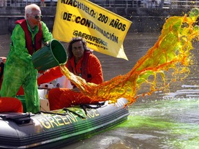 Reuters

Argentine artist Nicolas Garcia Uriburu, accompanied by Greenpeace activists, releases dye into the Riachuelo River, Argentina's most polluted basin, to turn it green during a demonstration on World Water Day in 2010.