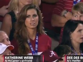Miss Alabama, Katherine Webb, appears momentarily on TV during the U.S. College football title game, a split-second now transformed into at least 15 minutes of fame.