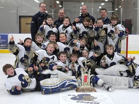The GP Petroleum AA Knights with their championship hardware. The Grande Prairie Knights won both the A and AA divisions at the 35th annual Lloyd Head Memorial Atom Hockey tournament at the Coca-Cola Centre in Grande Prairie, Alberta, Sunday, Jan. 20, 2013. TERRY FARRELL/DAILY HERALD-TRIBUNE