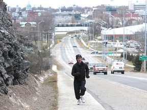 Bruce Crichton runs up the Barriefield hill Thursday morning. He has been running religiously since 1990. (Michael Lea The Whig-Standard)