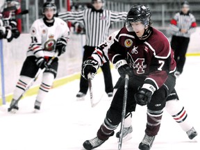 Chatham Maroons' Trevor Richardson is chased by Sarnia Legionnaires' Nathan Mater in the first period Sunday at Memorial Arena. (MARK MALONE/The Daily News)