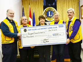 Pictured (left to right) Doug Earle, Mary Heimbecker, Tracy Clarke, Peggy Buckton and Ed Buckles smile big and hold up the cheque worth $1,000.