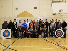 Teachers, parents, and community members gather at Aurora Elementary to help bring archery into local schools.