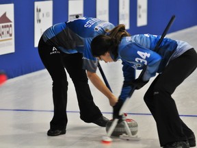 Sarnia's Stephanie LeDrew, right, sweeps alongside Courtney Davies, also of Sarnia, as part of Jill Mouzar's curling squad at a recent event. Team Mouzar is taking part in the Ontario Scotties Tournament of Hearts in Waterloo this week. SUBMITTED PHOTO/THE OBSERVER/QMI AGENCY