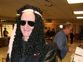 ‘Geddy Lee’ turned up for last year’s Curl For Kids Sake bonspiel in Tillsonburg, and Deb Landon, Executive Director for the Big Brothers Big Sisters of Ingersoll, Tillsonburg and Area also got into the ‘rock ‘n roll’ theme. This year’s event will pay tribute to the 100th anniversary of the organization this Saturday, February 9 in Tillsonburg, with focus on the centennial birthday party. People wishing to register a team for the 2013 Curl for Kids Sake or seek more information can call (519) 485-1801 or (519) 842-8542 or visit www.sharethefun.org. File Photos by Jeff Tribe