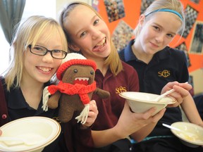 Sarnia Christian students Teagan Smink, Grace Vrolyk and Nicole Visser bid farewell to Domo who has been visiting their class from New Zealand at their Sarnia, Ont. school Monday, Jan. 21, 2013. The Grade 5/6 class has been Skyping with a New Zealand class who sent over their mascot Domo for a Canadian vacation. BARBARA SIMPSON / THE OBSERVER / QMI AGENCY