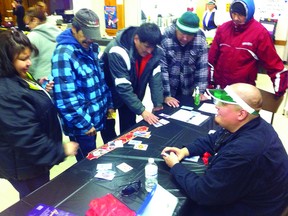 Gerry Standingready deals at the blackjack table at Don’t Bet On It, a responsible gambling mock casino at Jubilee Church over the weekend. Participants gambled with “Metis dollars” and could bid on real prizes at the day’s end. 
JON THOMPSON/Daily Miner and News