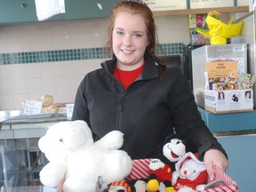 Kate Close displays donated teddy bears she wants to take to distribute to students in Newtown, Connecticut.