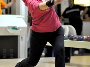 Dozens of bowlers descended on Mid-Town Bowl on Sunday for the 9th Annual Belanger Best Ball Tournament. Bowler Debbie Desloges was having so much fun at the tournament, she couldn't help but smile as she bowled.