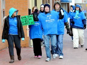 Students, teachers and supporters of St. Clair College Thames Campus' #Blue 2013 march along King Street from the college to increase awareness of mental health issues in youth. Monday January 21, 2013 is considered Blue Monday, the most depressing day of the year. PHOTO TAKEN  in Chatham, On. . DIANA MARTIN/ THE CHATHAM DAILY NEWS/ QMI AGENCY