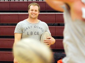 New Zealand rugby pro, Tristan Moran, watches a ballhandling drill during a clinic Monday at Moira Secondary School.