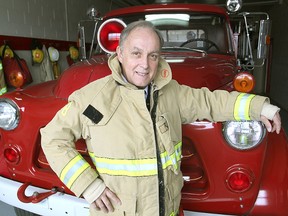 Gary Bullock, who retired as deputy fire chief of Kingston Fire & Rescue on Jan. 1, stands in front of an old Dodge fire truck at the Joyceville Road firehall.
Michael Lea The Whig-Standard