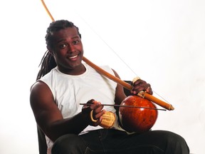 Baiano with his berimbau (an African style bow) and thecabaça (a dried, hollowed-out gourd).