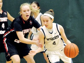 Chatham-Kent Wildcats' Logan Kucera, right, is guarded by Stoney Creek NYB Cardinals' Cierra Stiller in their opening game Friday at the Great West Invitational major bantam girls basketball tournament at St. Clair College's Thames Campus HealthPlex. The Wildcats finished in third place with a 3-2 record. (MARK MALONE/The Daily News)