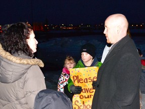 Minister of Education Jeff Johnson speaks with residents protesting HPS’s closure outside the PLRD office.  The Minister, who arrived by plane approximately an hour late, took the time to greet each individual present, before heading in to the meeting. Later that night he flew out to Lethbridge to meet with another Board of Trustees.