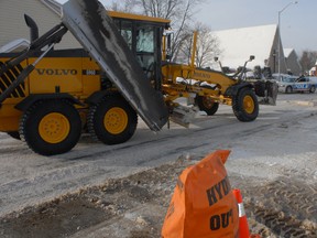 City crews scrap Wellington Street East after a fire hydrant leaked water on Tuesday, Jan. 22, 2013.