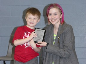 Darwin Wagar, 6, accepts a plaque from McKenna Modler for his donation of over $300 to McKenna's Dream in lieu of birthday presents. Wagar received the recognition at Thousand Islands Elementary School recently during their Character Ed assembly.
Amanda Smith Gananoque Reporter