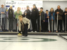 Chamber of Commerce President Marlene Beattie throws the first stone to open the Farm Curl Thursday.