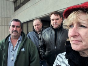 Cathy Baker, far right, is one of two plaintiffs and former Navistar employees who are seeking to recover proper severance pay and related compensation owing to more than 800 former workers who were terminated when the Richmond Street truck plant closed. She is flanked by Rick Reaume, CAW Local 127 president, left, Aaron Neaves, former CAW Local 127 president and Jim Mitchell, CAW national representative.
Diana Martin/ The Chatham Daily News