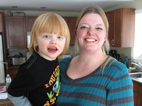Brenda Trautrimas of Battersea, holding her son Ayden, is trying to ensure he gets continued therapy for his autism. 
Michael Lea The Whig-Standard