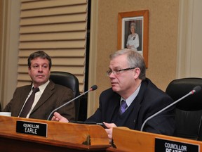 City Councillor Jeff Earle, right, argues in favour of deferring a motion on the Comprehensive Economic and Trade Agreement (CETA) while Councillor David LeSueur listens during Tuesday's council meeting. RONALD ZAJAC The Recorder and Times