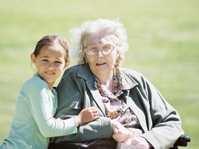 A young girl spends time with a senior during a SKIP visit in Brantford at Charlotte Villa. SUBMITTED PHOTO