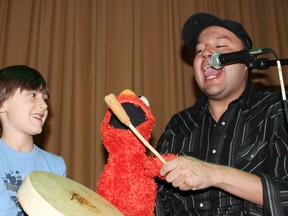 Derik Starlight shows off his Elmo impression at Blind River Public School while a very impressed Eli Cyr-Jensen, a Senior Kindergarten student at St. Mary’s Catholic School, watches closely on Thursday, Jan. 18 in Blind River. 	     
Photo by JORDAN ALLARD/THE STANDARD/QMI AGENCY