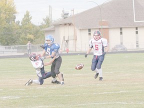 Jeff Blay/QMI Agency
Peace River Pioneers linebacker Hunter Meston (right, No. 5) looks on as a teammate gets tackled during a game at Glenmary Field in 2011. The Record-Gazette recently caught up with the grade 12 Glenmary High School student.