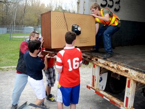 An old television is lifted into the back of a truck with some help from members of the Quinte West Youth Centre last April, where staff and youth held an electronics recycling drive. They have organized another one for this Saturday, Jan. 26
Trentonian file photo