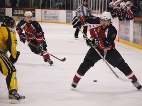 North Bay Trappers forward Tait Seguin drops a back pass for teammate Brandon Janke during action from Friday, Jan. 18 at the Centennial Arena in Elliot Lake. 				   
Photo by STEVE ANTUNES/FOR THE STANDARD