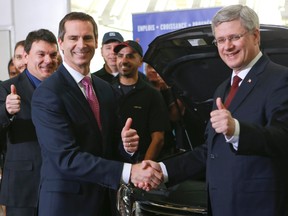 Ontario Premier Dalton McGuinty and Prime Minister Stephen Harper take a tour of the Toyota manufacturing plant in Cambridge Wednesday, Jan. 23, 2013. (Dave Thomas/Toronto Sun)