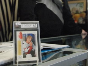 Glen MacKenzie, owner of The Old Bank Antique Market in Bruce Mines, displays a Joe Thornton rookie card.