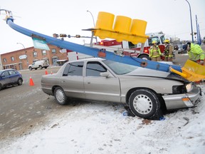 One man was sent to hospital with unknown injuries Wednesday morning following a single-vehicle collision involving a traffic control pole downtown. Police say that since the light standard has been knocked down, the intersection will be treated as a four-way stop. ADAM JACKSON/DAILY HERALD-TRIBUNE