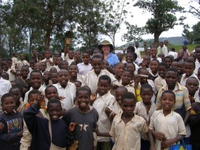 SUBMITTED PHOTO.Wanda Burchert stands amongst a group of school children in Northeastern Tanzania during a review of an anti-malarial program.