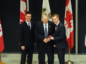Roy Borstad (centre) is awarded with the QEII Diamond Jubilee Medal by Grande Prairie Mayor Bill Given, left, and Peace River MP Chris Warkentin, right, at Teresa Sargent Hall inside the Montrose Cultural Centre Tuesday. (Adam Jackson/Daily Herald-Tribune)