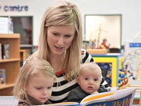 BRIAN THOMPSON, The Expositor

Lindsay Brown of Brantford reads The Farm Team with her three-year-old daughter, Gwen, and three-month-old son, Colton, on Wednesday at the Brantford Public Library.