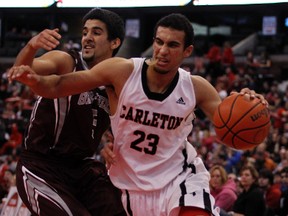 Gee-Gees' Mehdi Tihani, left, chases down Carleton Ravens' Philip Scrubb, right, during the MBNA Capital Hoops Classic in January at Scotiabank Place. (Darren Brown, Ottawa Sun)