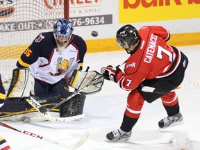 Barrie Colts goalie Mathias Niederberger makes a save on Owen Sound Attack centre Daniel Catenacci during the first period of Wednesday night’s game at the Harry Lumley Bayshore Community Centre.