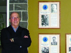Harry Jemmett, the chair of the selection committee for the Kingston & District Hall of Fame, beside plaques of some of the many Kingston-area athletes who have been inducted into the The Hall of Fame located inside the K-Rock Centre.     Justin Smith - Kingston This Week