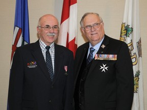 Former Fairview resident Lawrence Chorney, now of Dunmore, poses for a photo with Lt.-Gov. Donald S Ethell at the Pomeroy Hotel in  Grande Prairie. Chorney and 22 others were awarded with the Queen Diamond Jubilee medal during a ceremony Jan. 18. (Adam Jackson/Peace Country Sun)