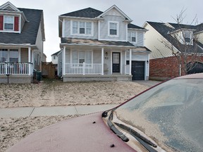 BRIAN THOMPSON, The Expositor

Dirt covers homes and vehicles on Avedisian Street.