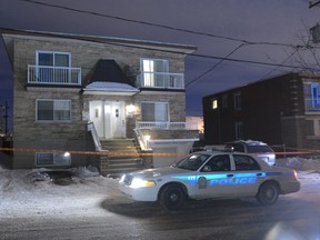 Police shot a suspect after two men were stabbed in Laval, Thursday, January 24, 2013.  (ERIK PETERS/QMI Agency)
