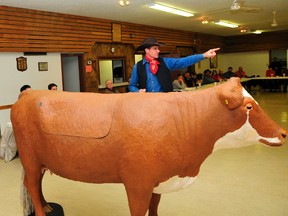 Curt Pate talks to more than 30 beef producers at the Albright Hall, which is located between Hythe and Beaverlodge. The event marks the second annual UFA Cattle College, which features Lucy, a mock cow. (Aaron Hinks/Daily Herald-Tribune)