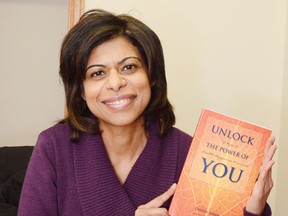 Wetaskiwin’s Shanti Wellness Centre director Zaheen Nanji holds up Unlock the Power of You, 12 keys to health, happiness & success, which she helped co-write.