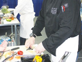 Jesse Chambers, head chef at The Glens Grill, right, seen here competing against Pipestone Food Co. owner Brady Weiler in the inaugural Wetaskiwin Iron Chef competition last year, will be back to defend his title at the 2013 trade show, which is scheduled for April 12 and 13.