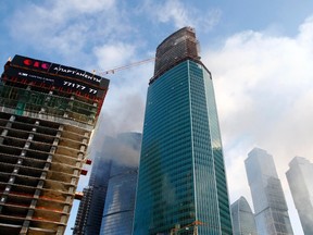 Smoke is seen rising above the towers of the Moscow International Business Center in Moscow Jan. 25, 2013. (REUTERS)